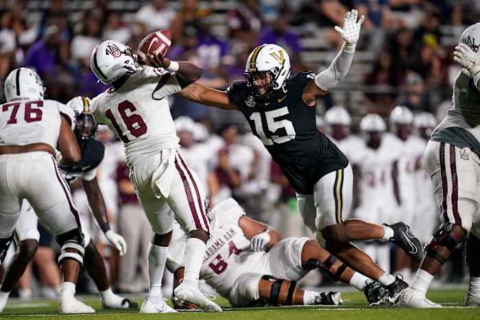 Vanderbilt defensive end Nate Clifton (15) puts pressure on Alabama A&M quarterback Xavier Lankford (16) during the fourth quarter at FirstBank Stadium in Nashville, Tenn.